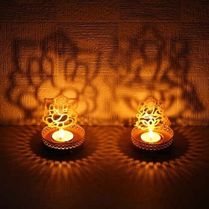 eCraftIndia Laxmi Ganesha Shadow Tea Light Holder Iron Tealight Holder  (Gold, Pack of 2)